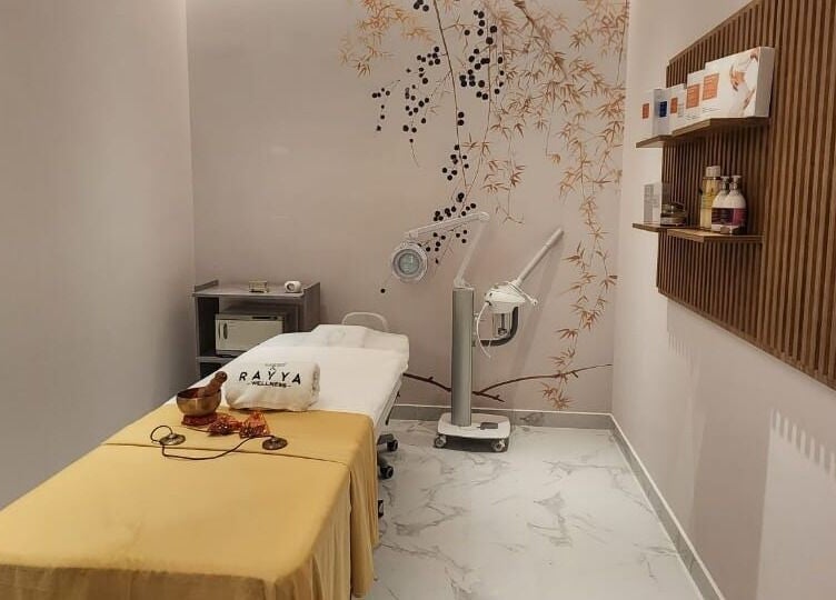 Tranquil treatment room at Rayya Wellness, Hotel Local, Dubai, AE, featuring massage bed and calming decor.