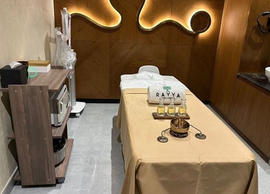 Massage room at Rayya Wellness, Sky Bay Hotel in Dubai, AE with treatment bed and natural decor.