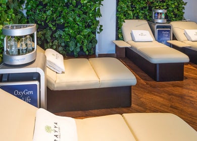 Luxurious lounge at Rayya Wellness, Sky Bay Hotel, Dubai, AE with serene green walls and beige recliners.