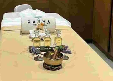Massage table setup with oils at Rayya Wellness, Sky Bay Hotel, Dubai, AE, creating a tranquil spa ambiance.