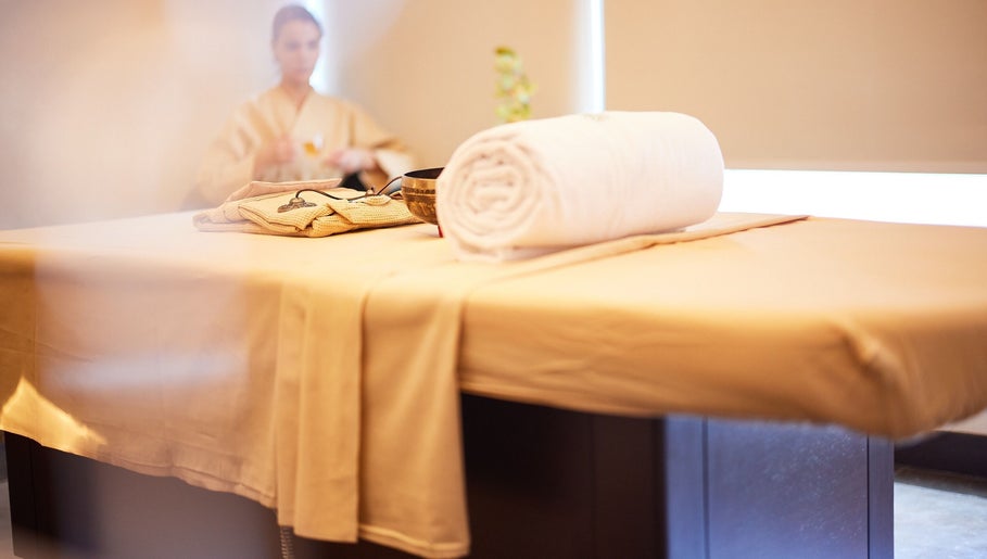 Serene spa room at Rayya Wellness TFC Waterfront, Dubai, Dubai, AE showcasing a massage table with plush towels.