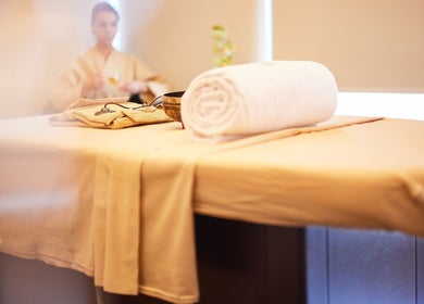 Serene spa room at Rayya Wellness TFC Waterfront, Dubai, Dubai, AE showcasing a massage table with plush towels.