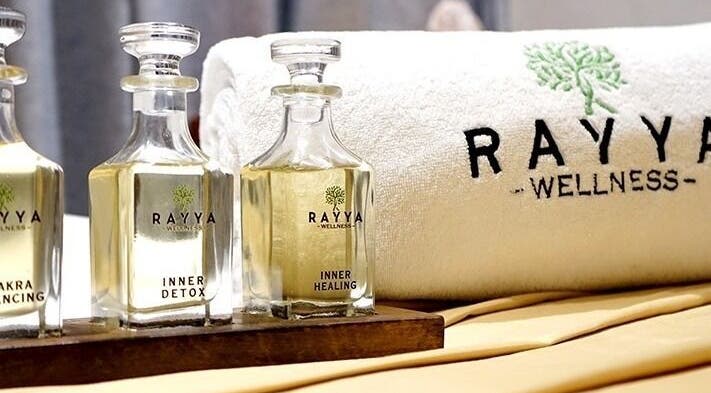 Elegant oils and towel at Rayya Wellness, The First Collection, JVC in Dubai, AE, symbolize luxury and relaxation.