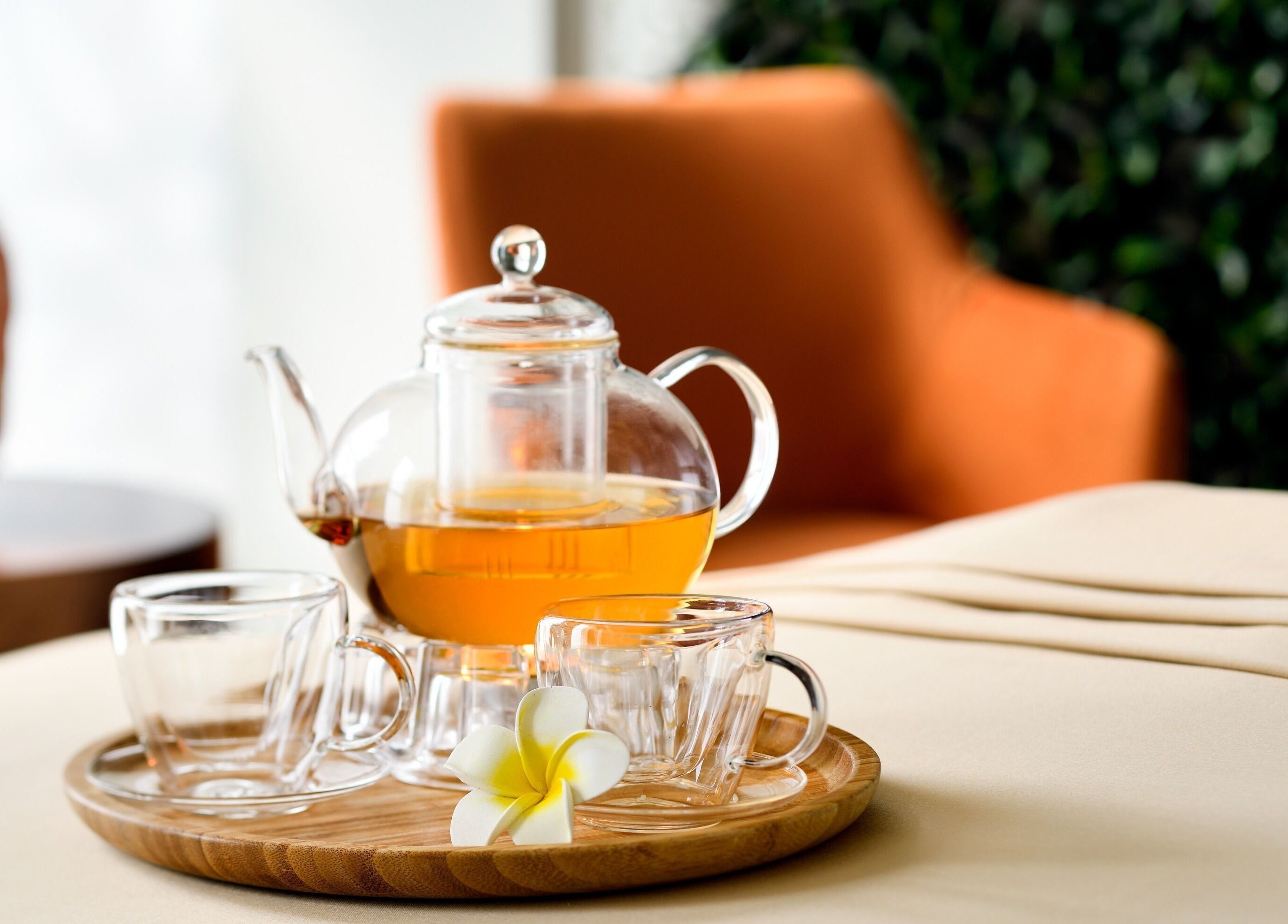 Tranquil tea setting at Rayya Wellness, The First Collection, JVC in Dubai, AE with tea pot and flower.