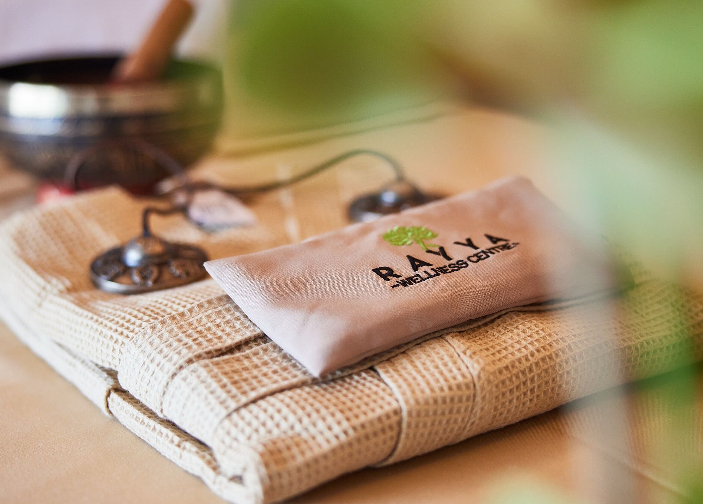 Relaxing spa setup at Rayya Wellness, The First Collection, JVC, Dubai, AE, featuring calming elements.