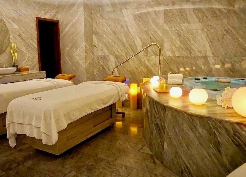 Luxurious spa room at Rayya Wellness, The Retreat Palm Dubai Spa, Dubai, Dubai, AE, featuring plush massage tables.