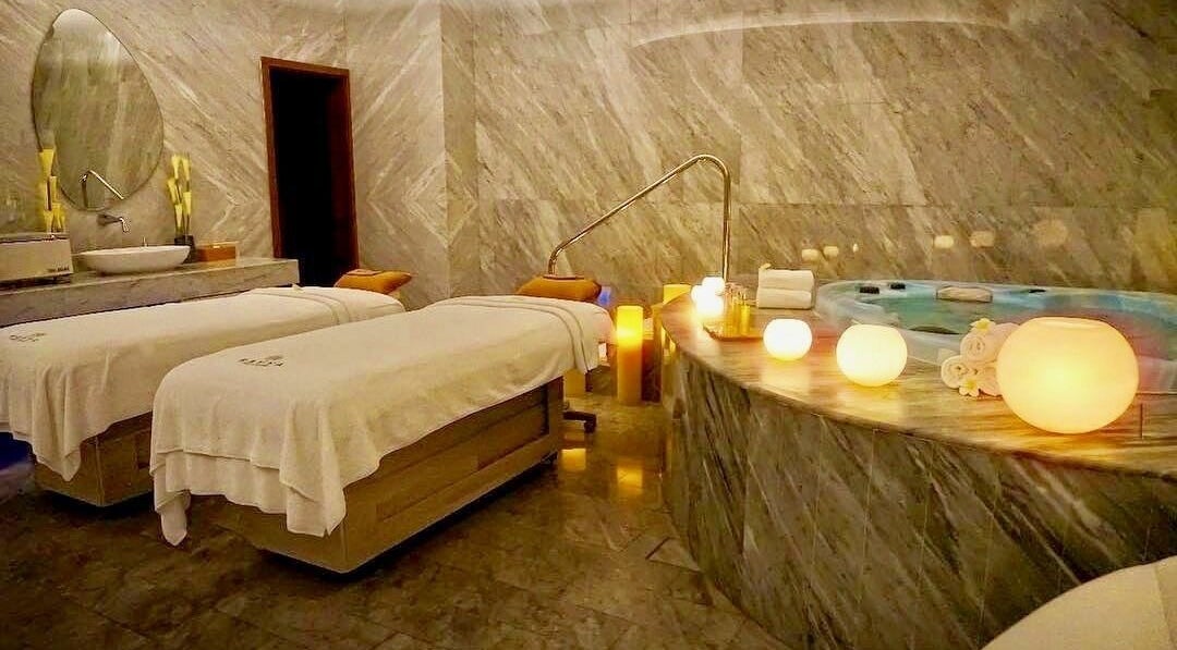 Luxurious spa room at Rayya Wellness, The Retreat Palm Dubai Spa, Dubai, Dubai, AE, featuring plush massage tables.