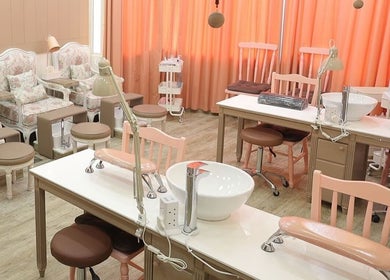 Chic and cozy nail care area at Plush Beauty Spa, Abu Dhabi, AE featuring elegant seating and soft lighting.