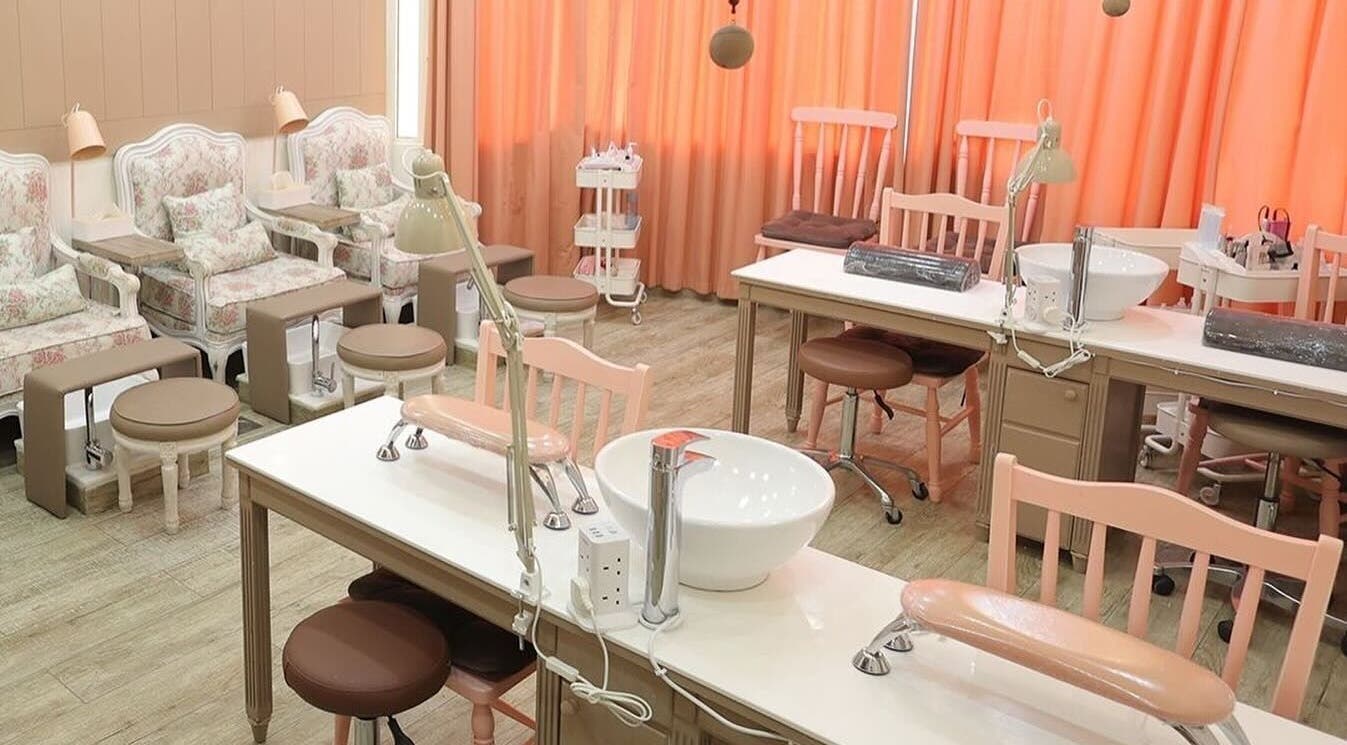 Chic and cozy nail care area at Plush Beauty Spa, Abu Dhabi, AE featuring elegant seating and soft lighting.