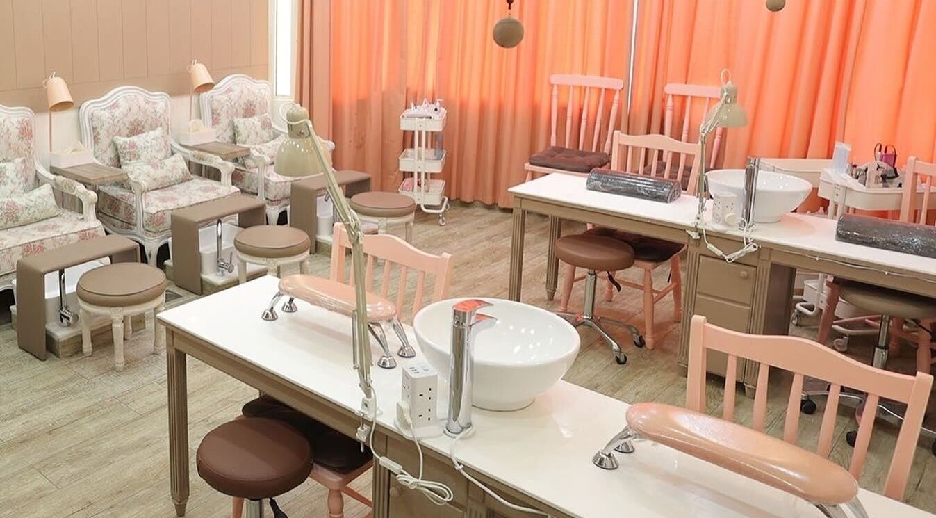 Chic and cozy nail care area at Plush Beauty Spa, Abu Dhabi, AE featuring elegant seating and soft lighting.