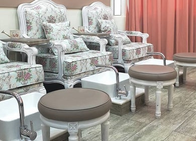 Floral pedicure chairs at Plush Beauty Spa, Abu Dhabi, AE offer a cozy and elegant experience.