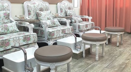 Floral pedicure chairs at Plush Beauty Spa, Abu Dhabi, AE offer a cozy and elegant experience.