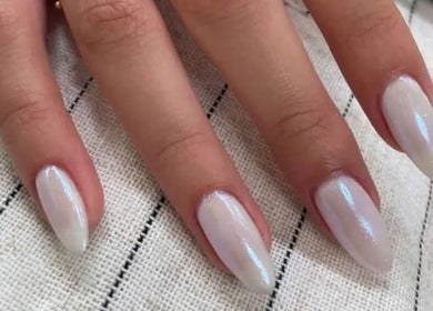 Elegant nails with a pearly sheen at Plush Beauty Spa, Abu Dhabi, AE.