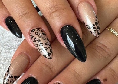 Stylish leopard print nails at Plush Beauty Spa, Abu Dhabi, AE, displaying trendy nail art.