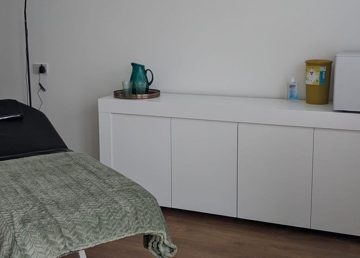 Relaxing treatment room at SALO Aesthetics, Plymouth, England, GB featuring a comfortable bed and clean decor.