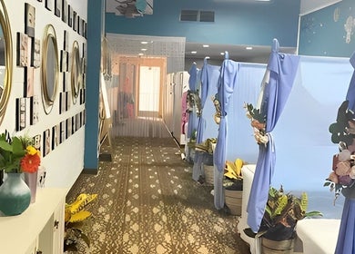 Chic interior of Canny Beauty Lashes (Arcadia) with decorative mirrors and blue drapes in Arcadia, California, US.