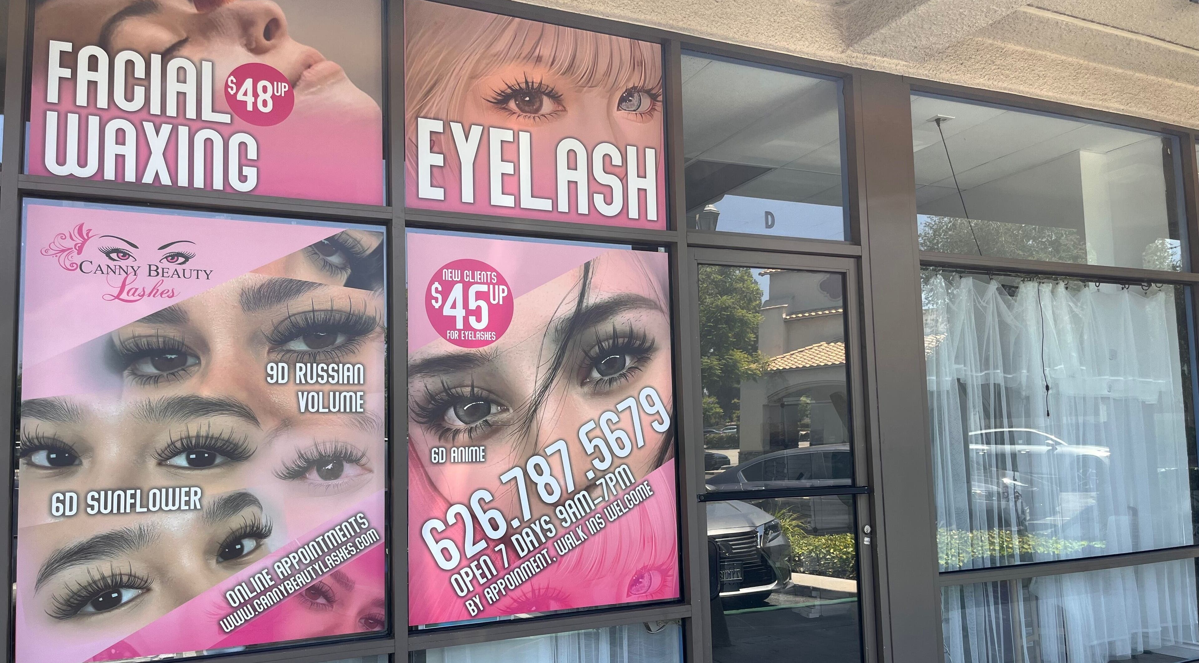Canny Beauty Lashes in San Dimas showcases eyelash services and prices on shop window, San Dimas, California, US.
