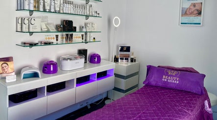 Beauty On Queen's serene treatment room in Ashmore, Queensland, AU featuring elegant decor and skincare products.