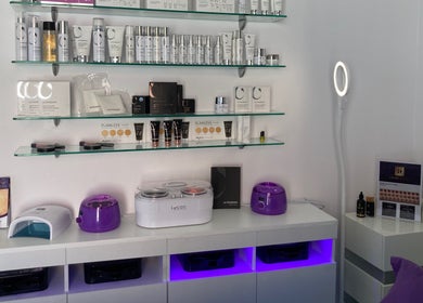 Beauty On Queen, Ashmore, Queensland, AU showcases premium beauty products on sleek glass shelves.