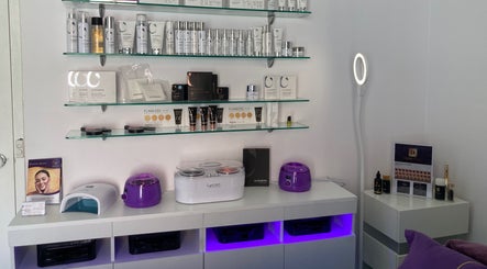 Beauty On Queen, Ashmore, Queensland, AU showcases premium beauty products on sleek glass shelves.