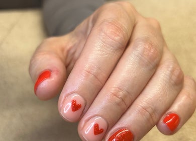 Red heart nail design at Bare Beauty, Strensall, England for chic and elegant look.