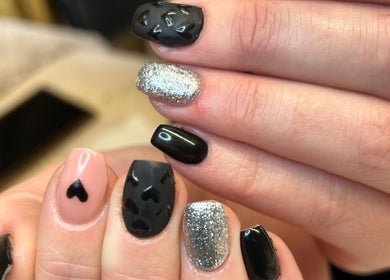 Chic nail art with black and silver design at Bare Beauty, Strensall, England, GB.