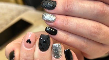 Chic nail art with black and silver design at Bare Beauty, Strensall, England, GB.