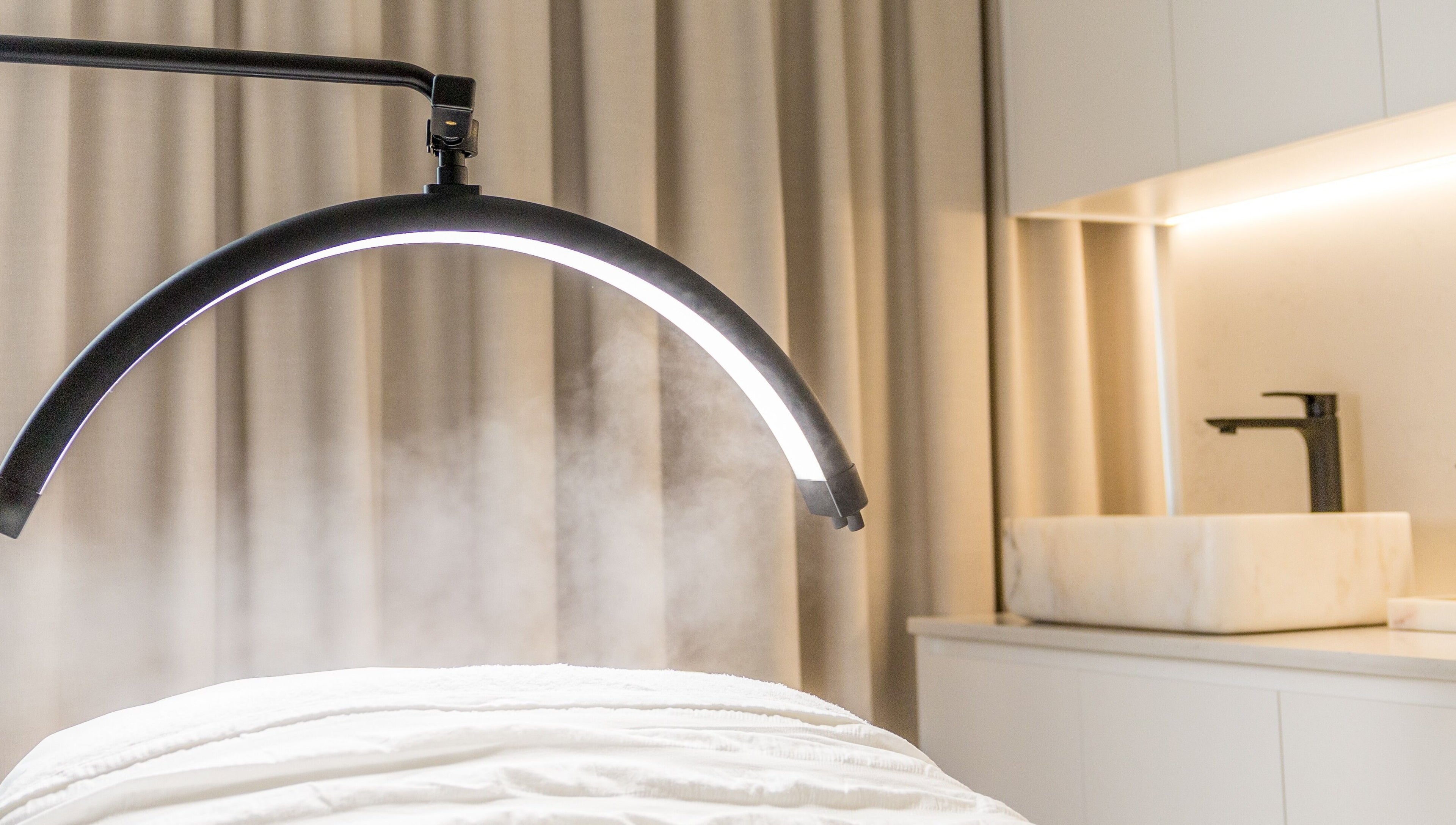 Serene treatment room at Simply Luminous Skin in Wentworth Point, New South Wales, AU with modern spa equipment.