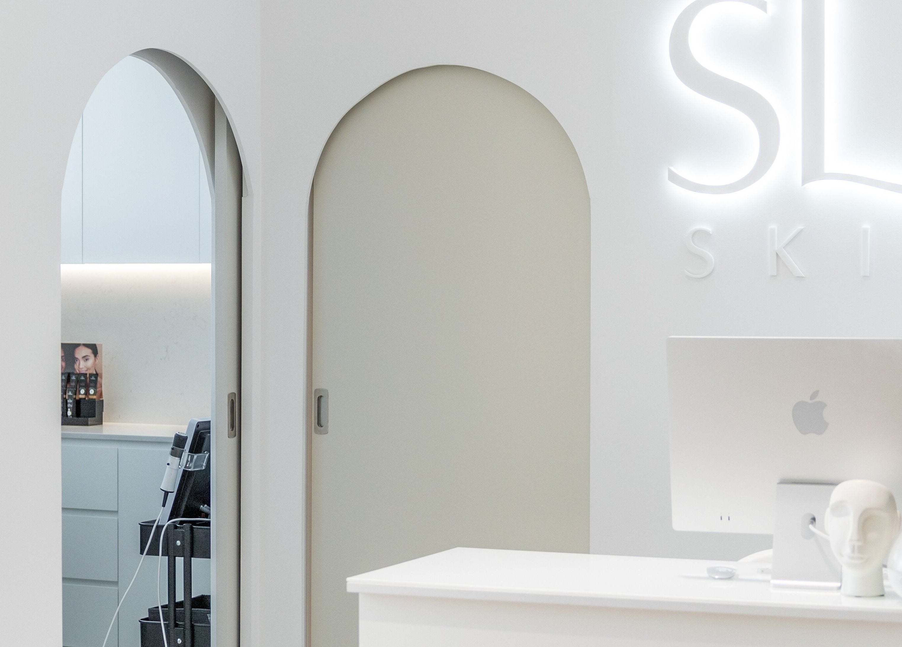 Reception desk at Simply Luminous Skin, Wentworth Point, New South Wales, AU with chic minimalist design.