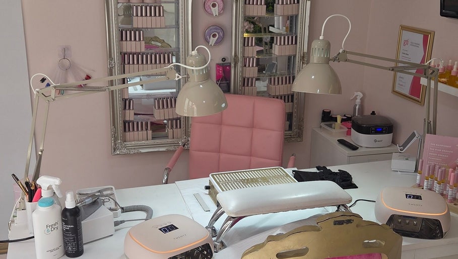 Bright nail salon workspace at Shardilly Nails in Hebburn, England, GB with pink chair and manicure tools.