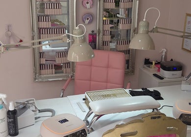 Bright nail salon workspace at Shardilly Nails in Hebburn, England, GB with pink chair and manicure tools.