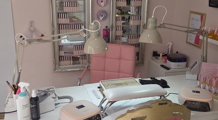 Bright nail salon workspace at Shardilly Nails in Hebburn, England, GB with pink chair and manicure tools.