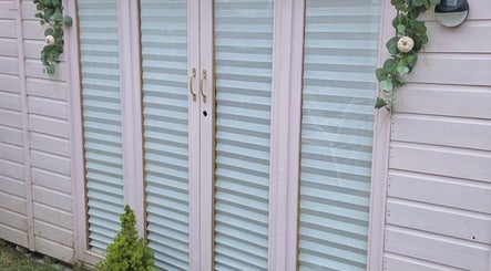 Elegant glass doors with plants at Shardilly Nails, Hebburn, England, GB.