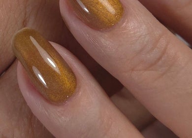 Close-up of gold nails at Shardilly Nails, Hebburn, England, GB showcasing intricate nail art.