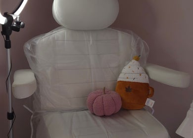 Comfortable chair at Shardilly Nails, Hebburn, England adorned with plush toys and a ring light setup.