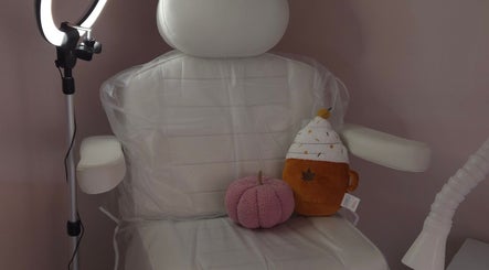 Comfortable chair at Shardilly Nails, Hebburn, England adorned with plush toys and a ring light setup.