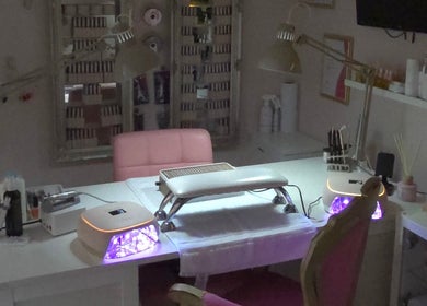 Nail treatment setup at Shardilly Nails in Hebburn, England, GB featuring manicure lamps and pink chair.