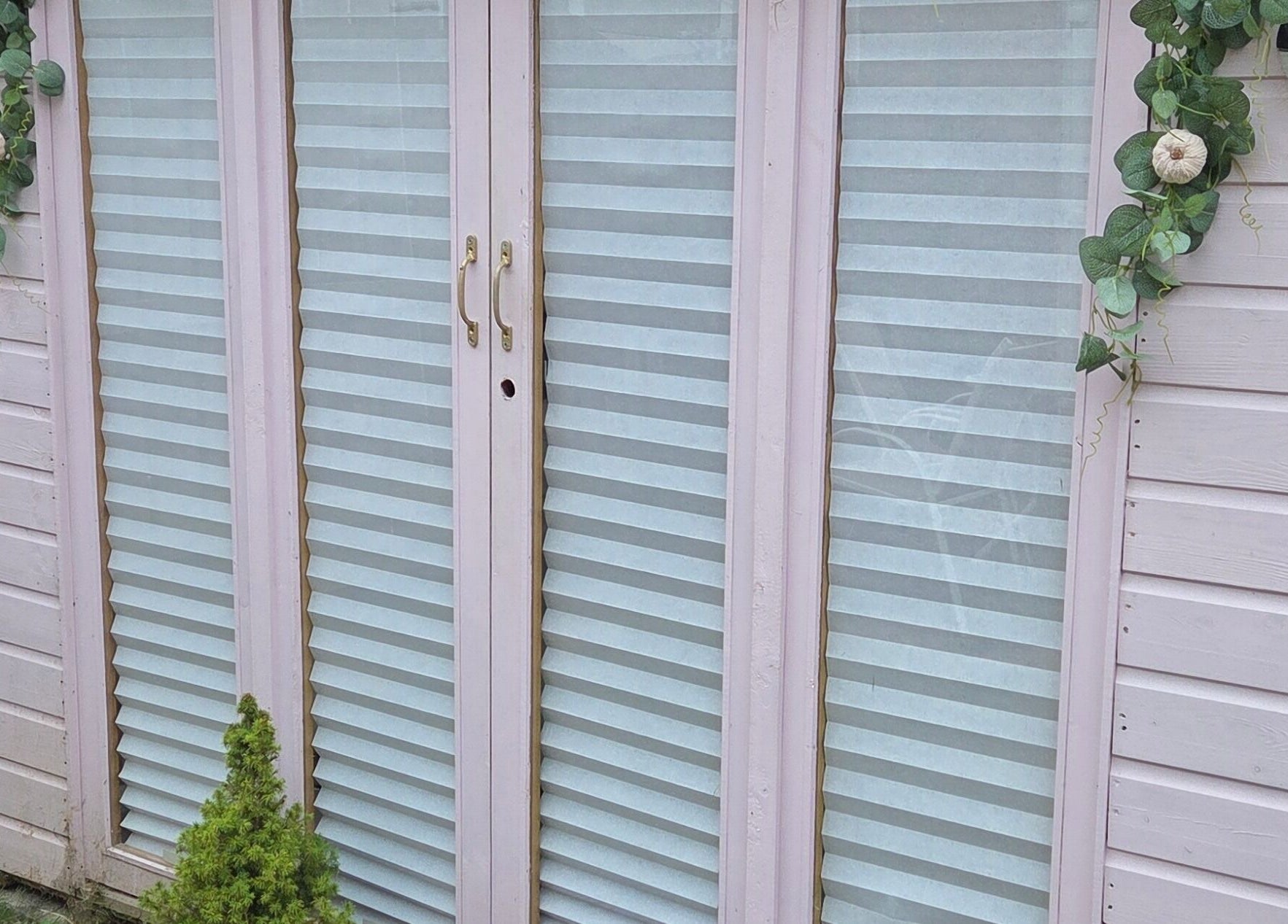 Elegant entrance of Shardilly Nails with pastel shutters, Hebburn, England, GB.