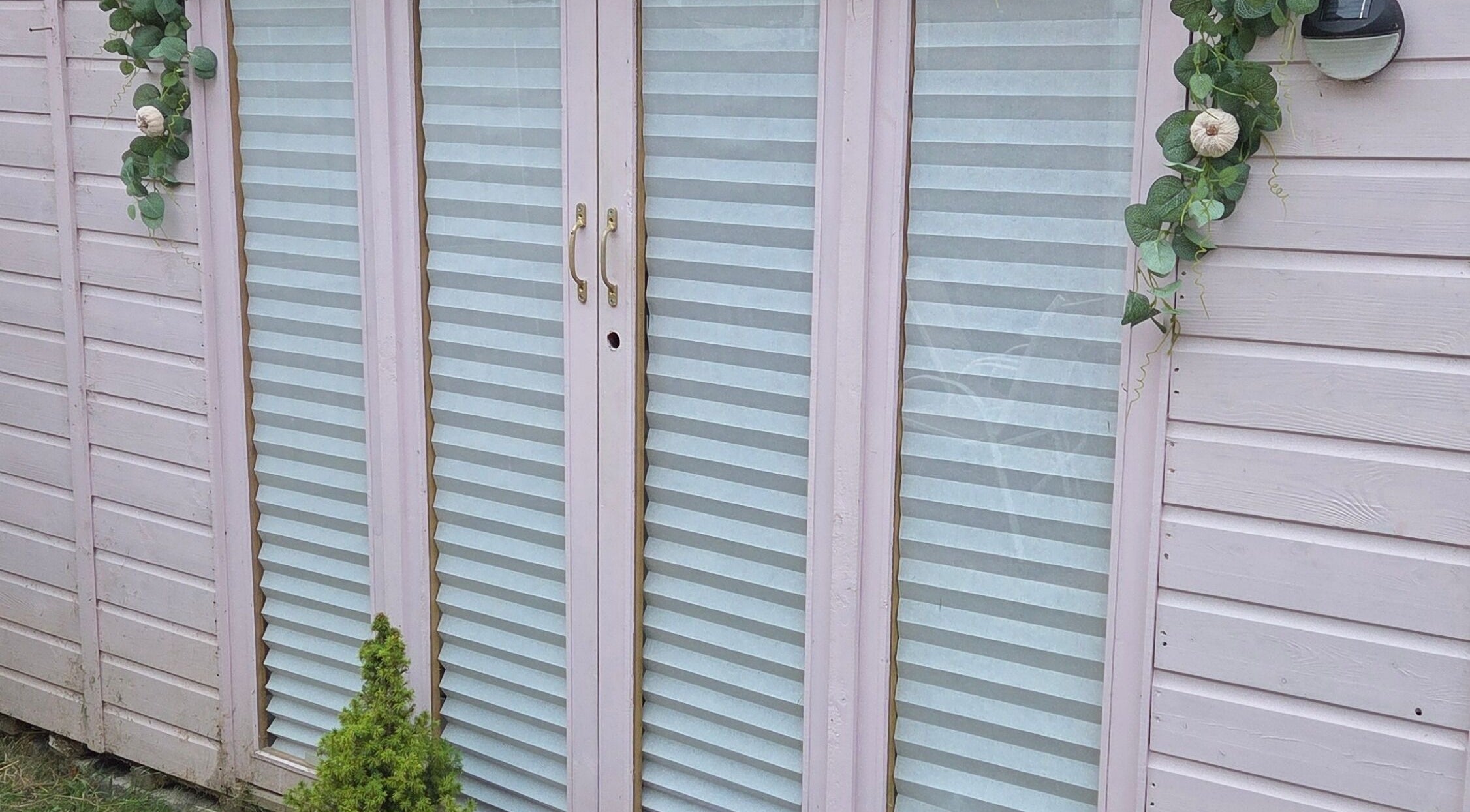 Elegant entrance of Shardilly Nails with pastel shutters, Hebburn, England, GB.