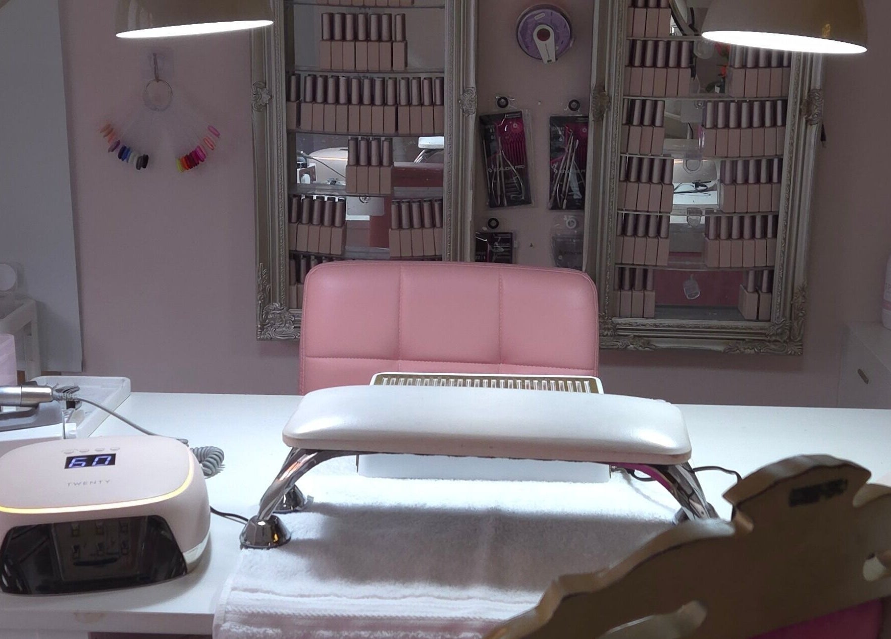 Modern nail station at Shardilly Nails, Hebburn, England, GB showcasing tools and polish display.