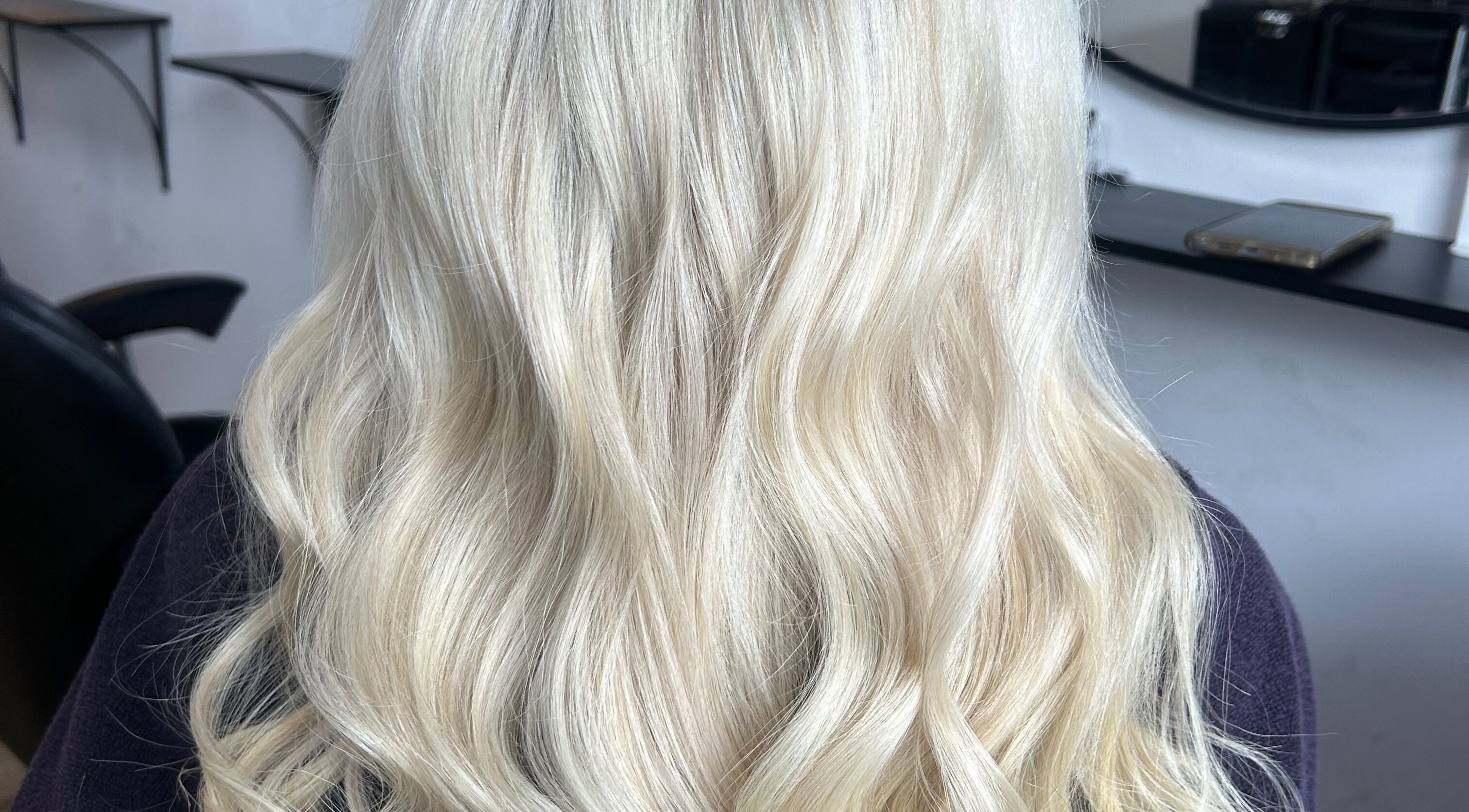Elegant blonde waves styled at Chloe Kerr Hair at SMN Serenity Hair & Beauty, Clarkston, Scotland, GB.