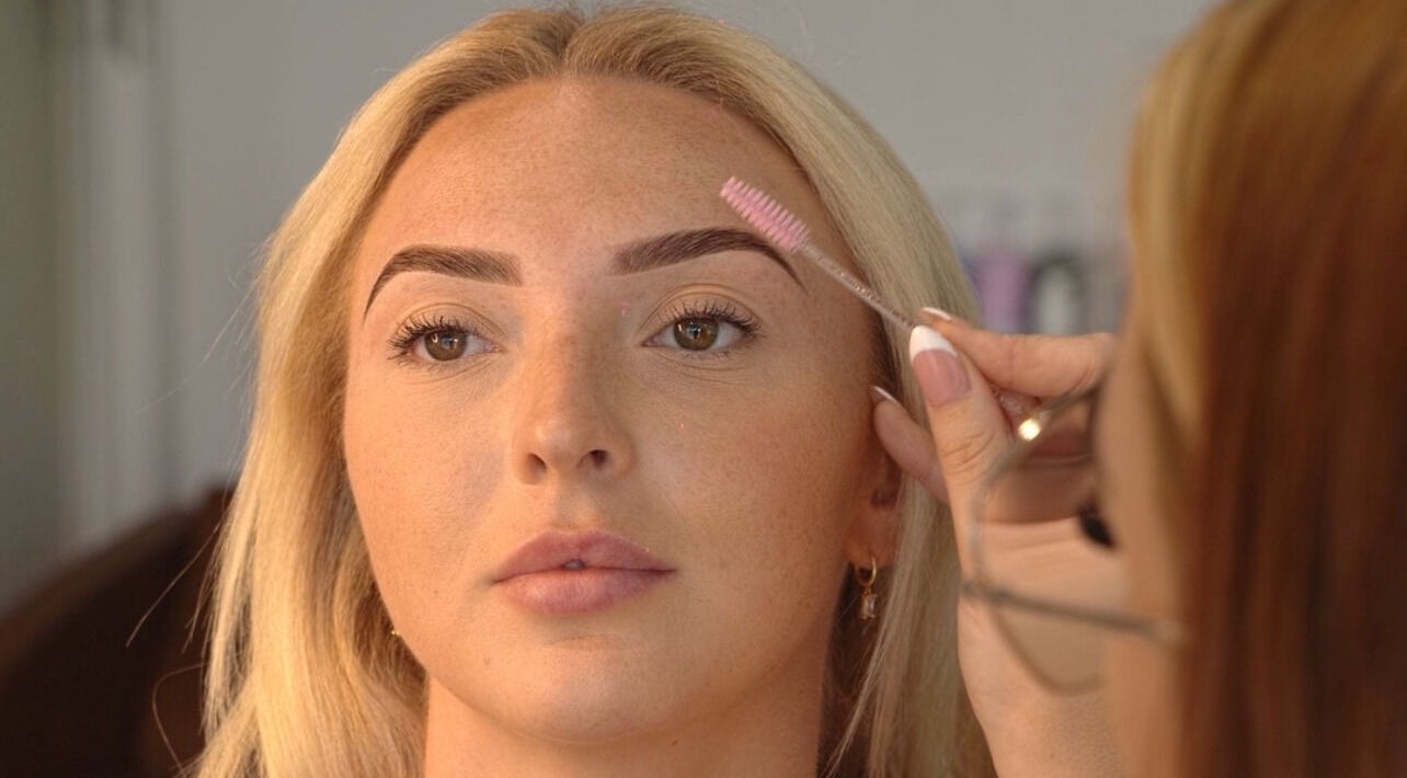 Lux Aesthetix beautician shapes brows for client at Mooloolaba, Queensland, AU.