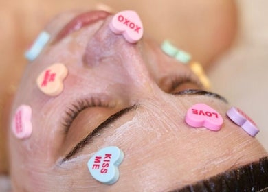 Facial treatment with heart candies at Sculpted Aesthetic Miami, Miami Lakes, Florida, US.