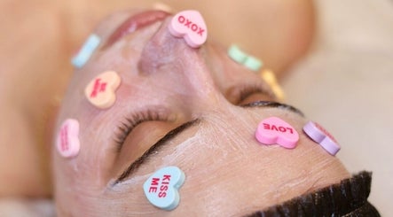 Facial treatment with heart candies at Sculpted Aesthetic Miami, Miami Lakes, Florida, US.