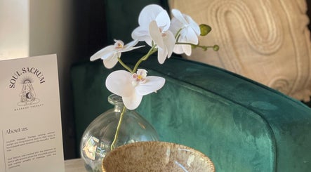 Elegant orchid and Soul Sacrum brochure in serene setting at Soul Sacrum Massage Therapy, Stoneville, Western Australia, AU.