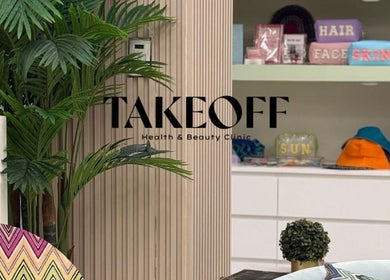 Modern, stylish interior of Take Off Beauty Clinic in Dubai, Dubai, AE, showcasing vibrant decor and greenery.