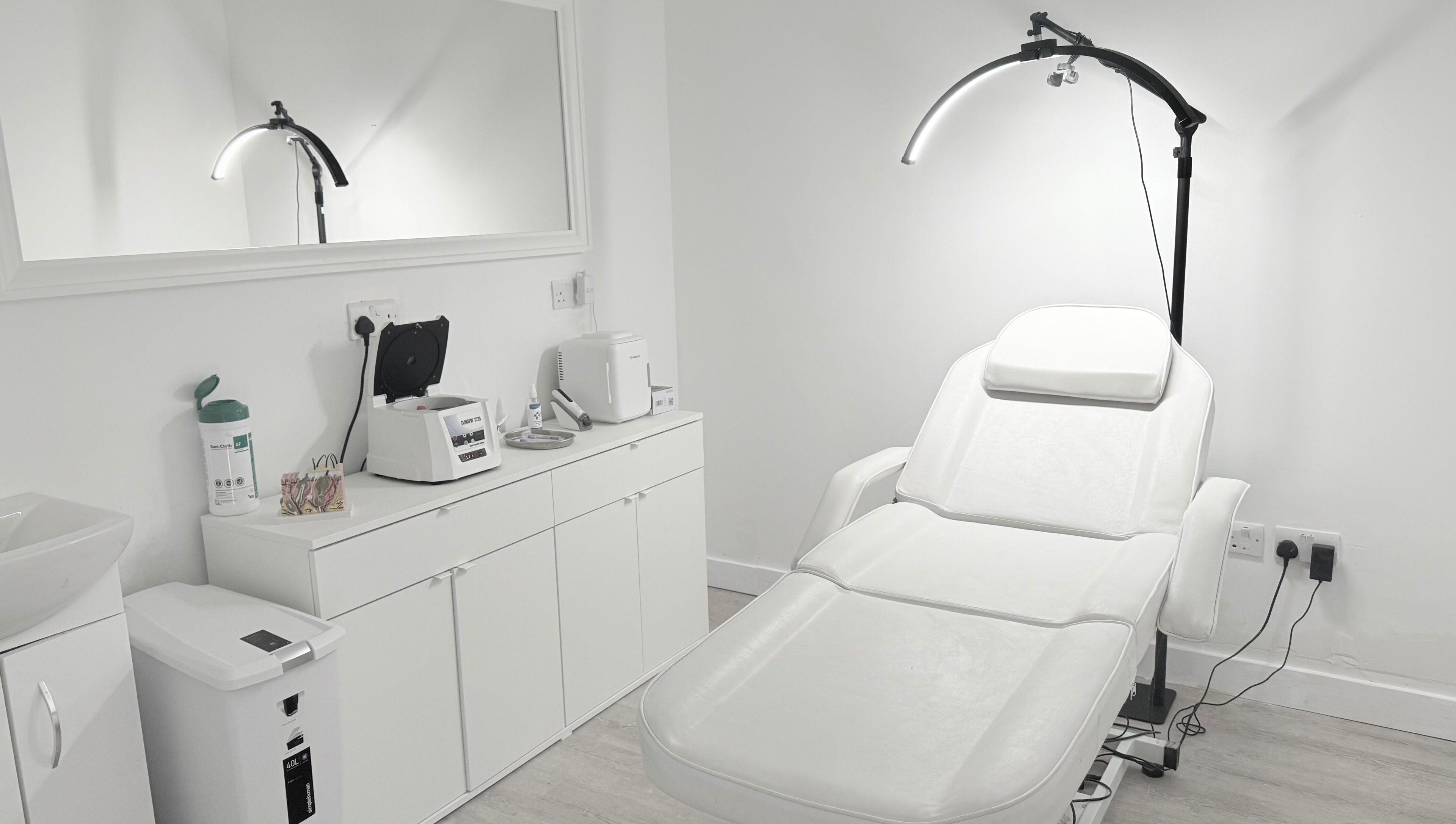 Elegant treatment room at Facefull Aesthetics, London, England, GB with modern equipment.