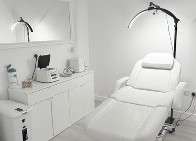 Elegant treatment room at Facefull Aesthetics, London, England, GB with modern equipment.