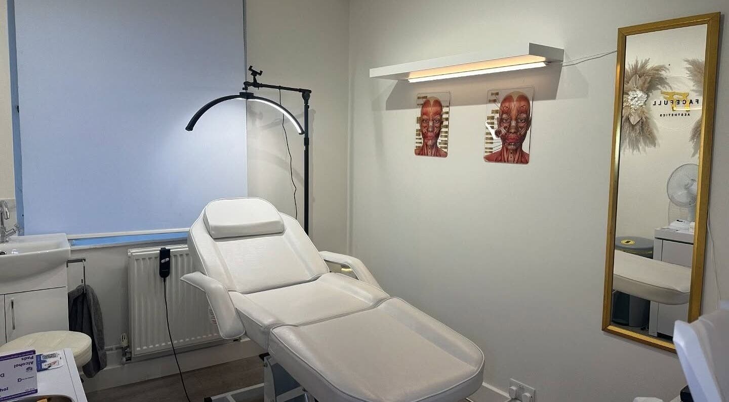 Modern treatment room at Facefull Aesthetics, London, England, GB featuring a comfortable white spa chair.
