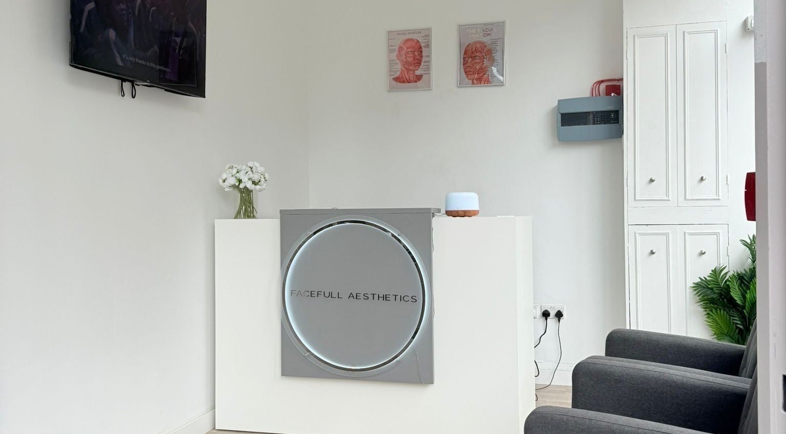 Reception area of Facefull Aesthetics in London, England, GB with modern decor and welcoming atmosphere.